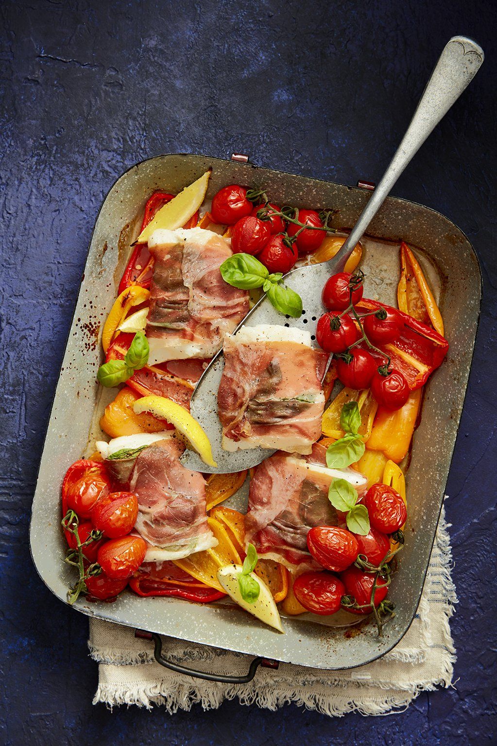 Parma-wrapped Fish Tray Bake with British Vine Tomatoes